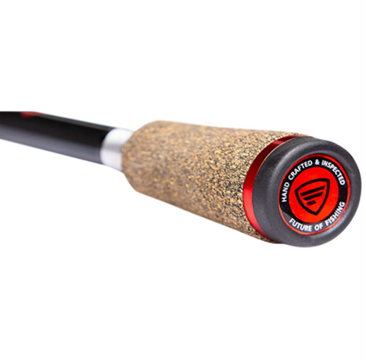 Close-up of a fishing rod handle with cork grip and red accent on a white background