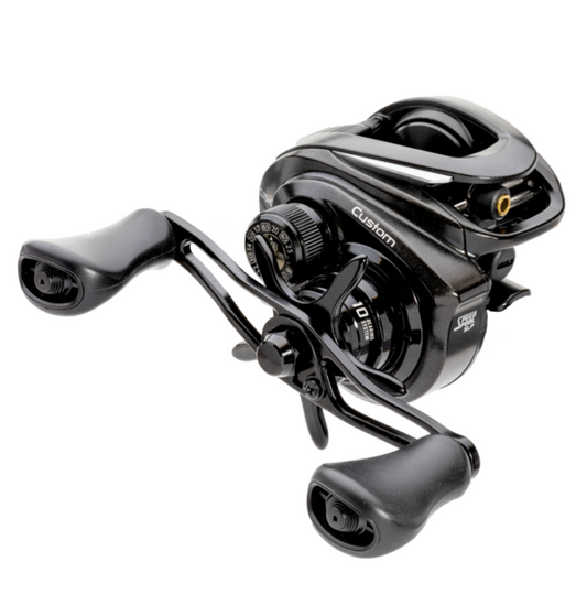 Black fishing reel on a white background