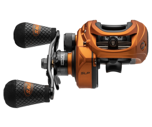 Orange and black fishing reel on a white background