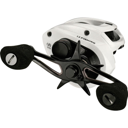 Fishing reel with white frame and black components on a white background