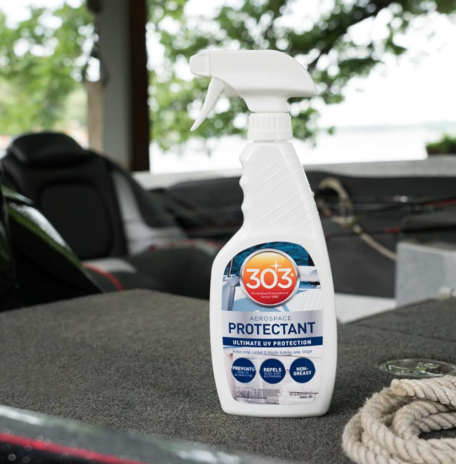 303 Aerospace Protectant spray bottle on a boat deck with trees in the background