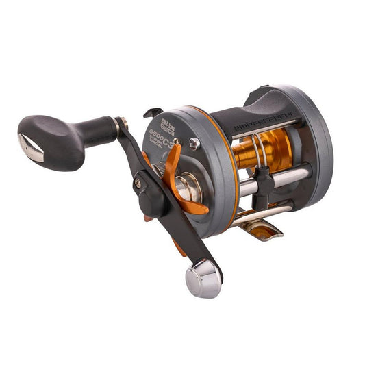 Fishing reel with metallic components on a white background