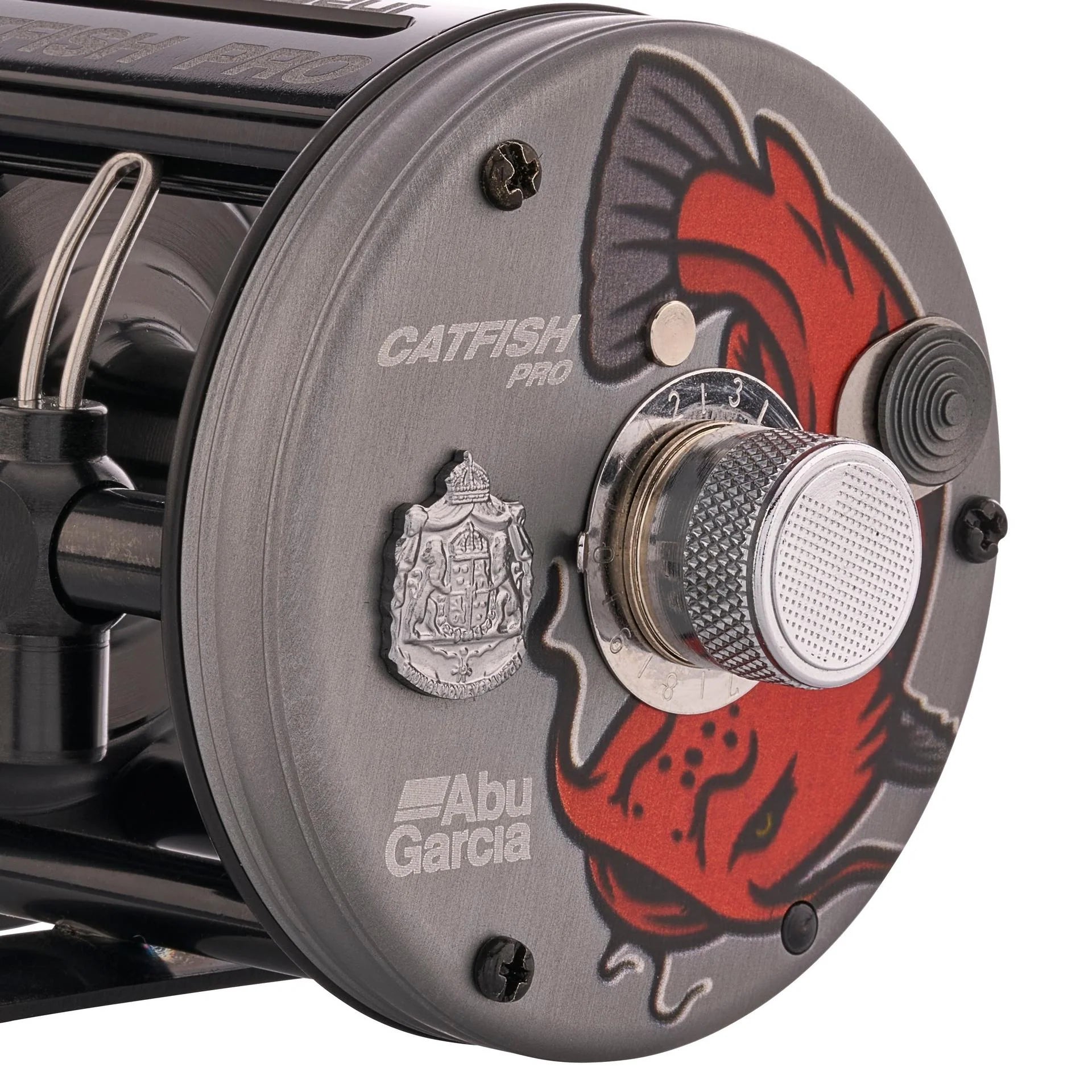 Close-up of Abu Garcia Catfish Pro fishing reel with red and black design.