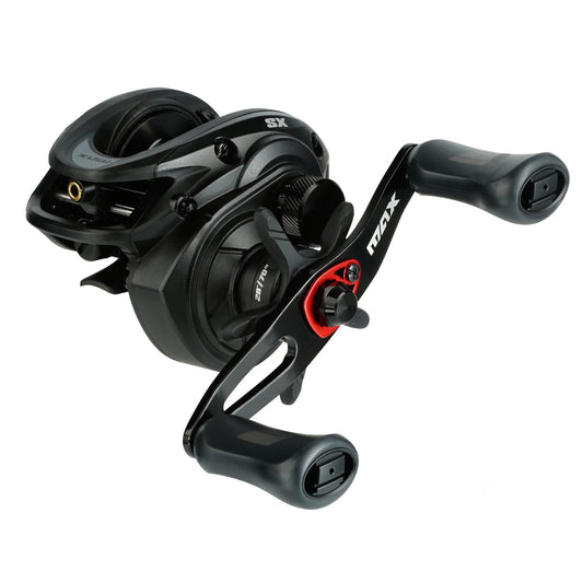 Black and red fishing reel on a white background