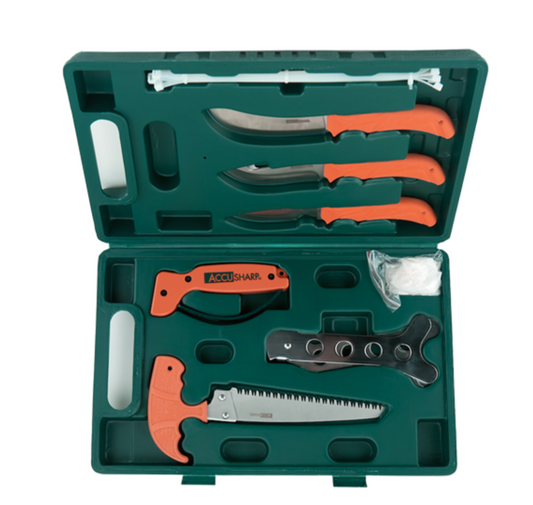 Green case with hunting tools including knives and a saw on a white background