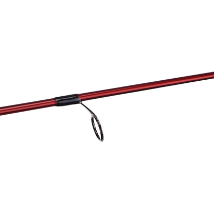 Fishing rod with cork handle and red tip on a white background