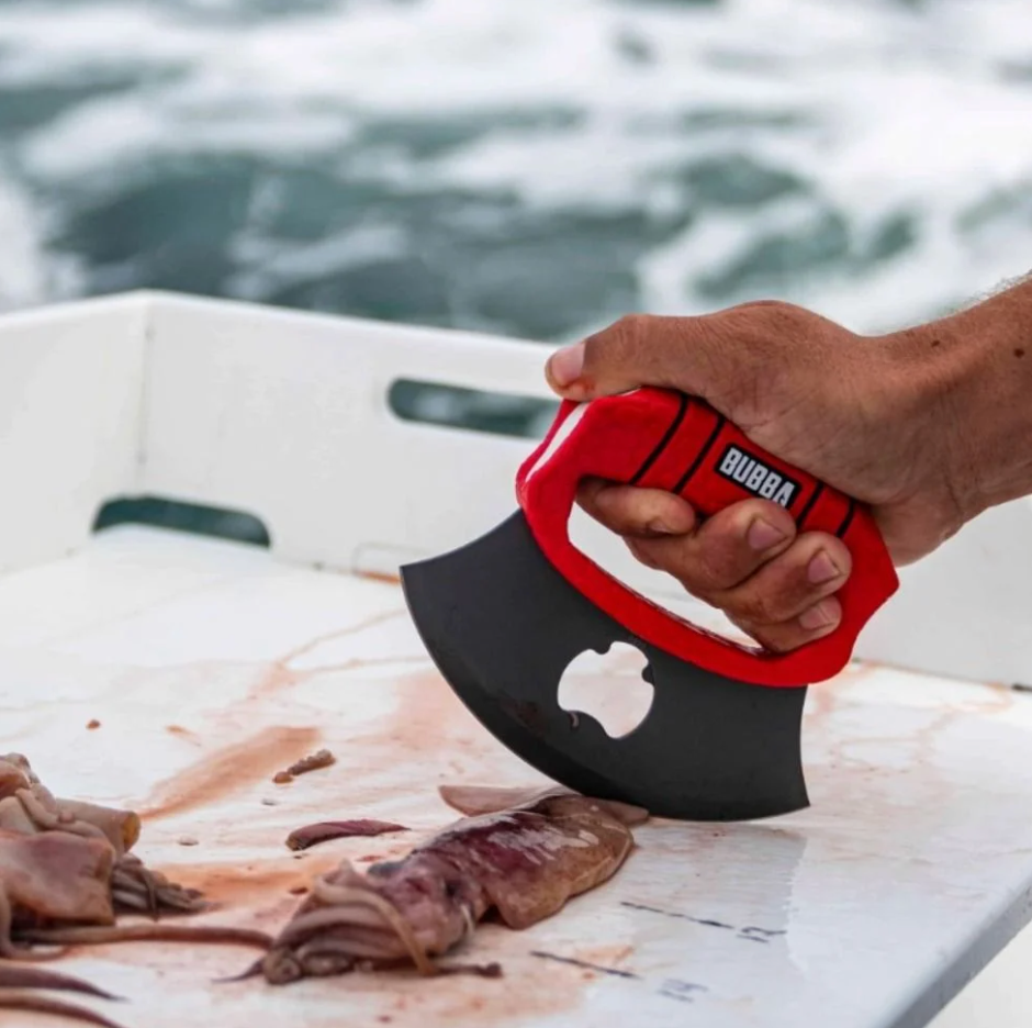 Person holding a red and black axe with 'Bubba' branding over a boat with fish.