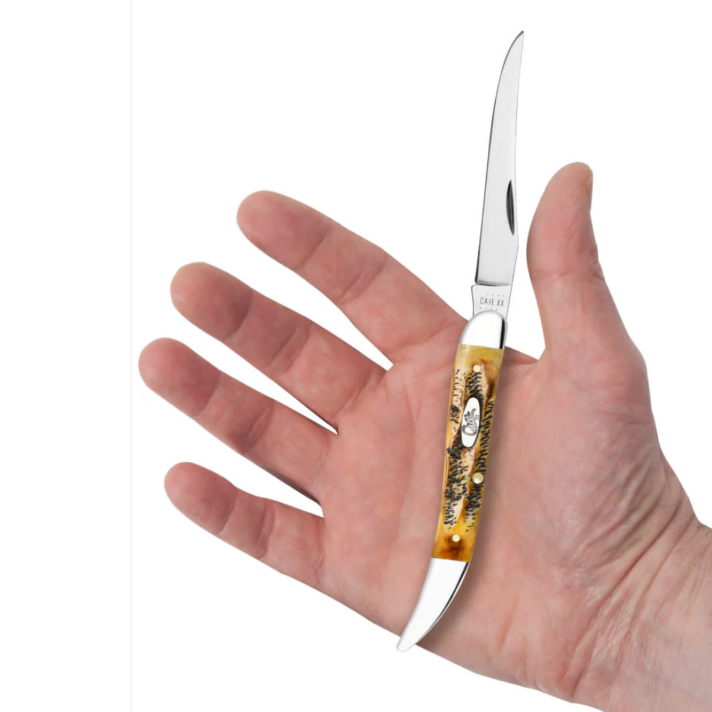 Hand holding a folding knife with a decorative handle on a white background