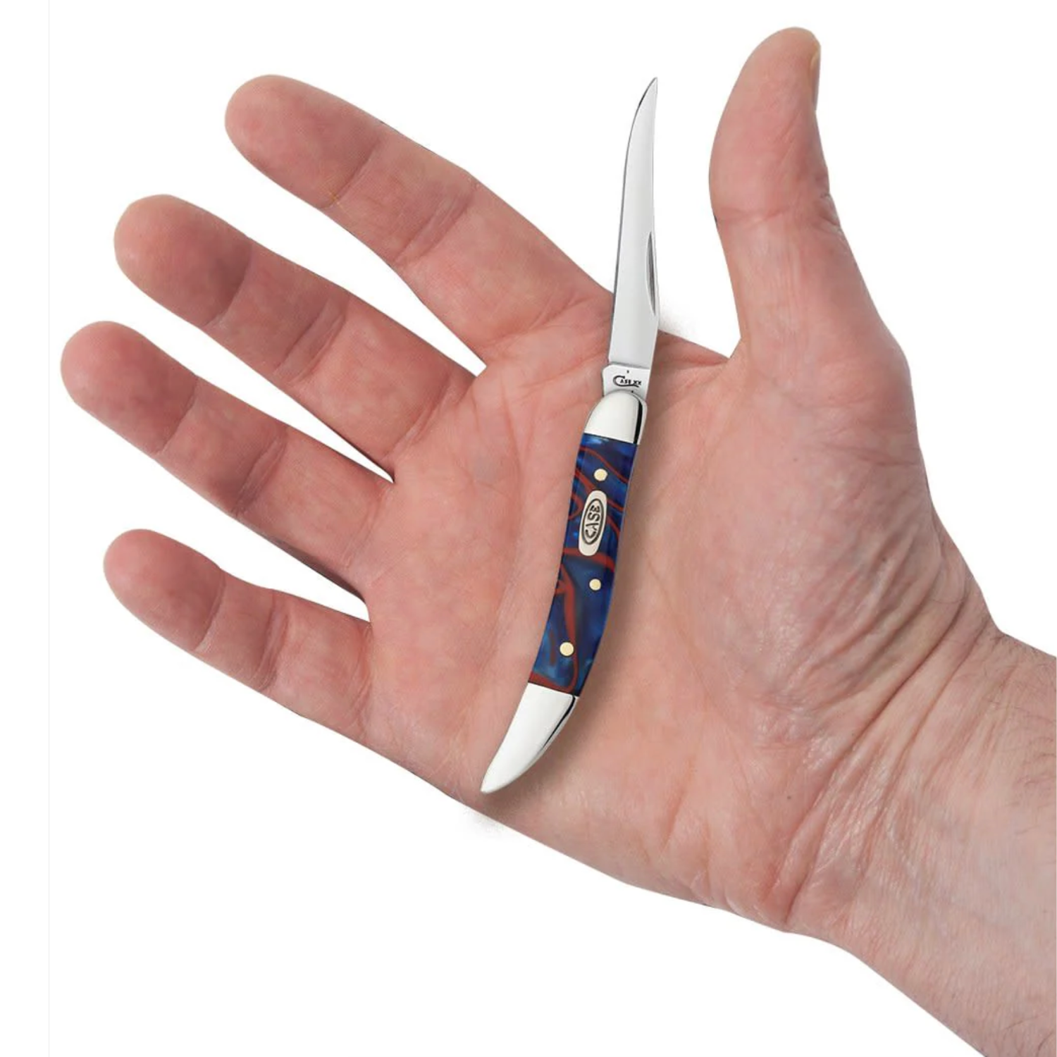 Small knife with a blue handle held in a hand against a white background