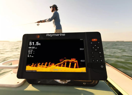 Raymarine marine navigation display on a boat with a person fishing in the background