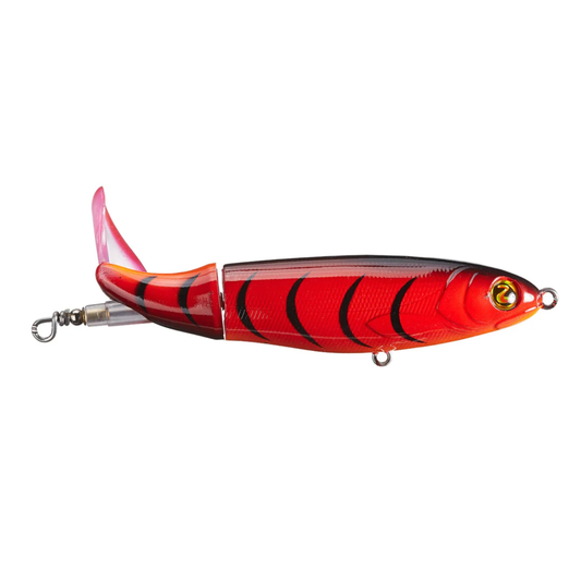 Red and black fishing lure on a white background