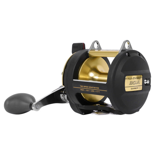 Fishing reel with black and gold finish on a white background