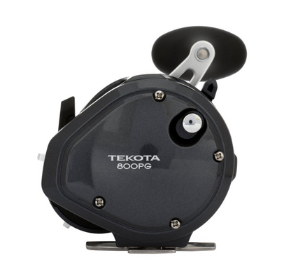 Black fishing reel with 'Tekota' branding on a white background