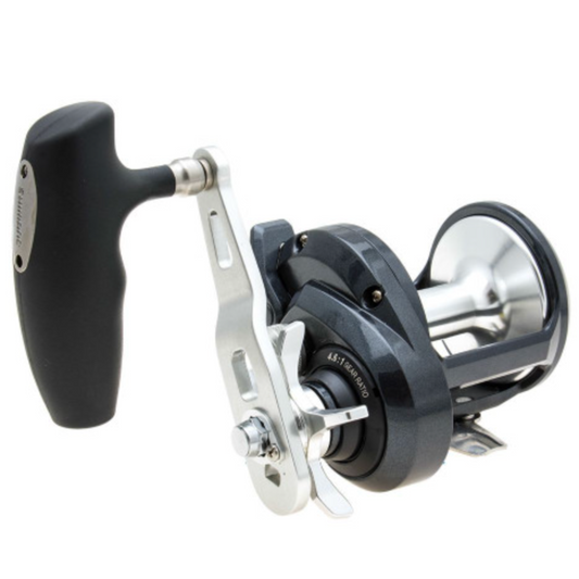Fishing reel with black handle and silver metal components on a white background