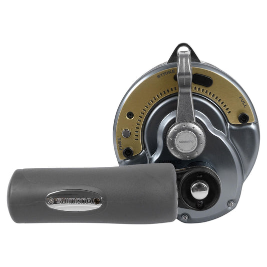 Fishing reel with gold spool on a white background