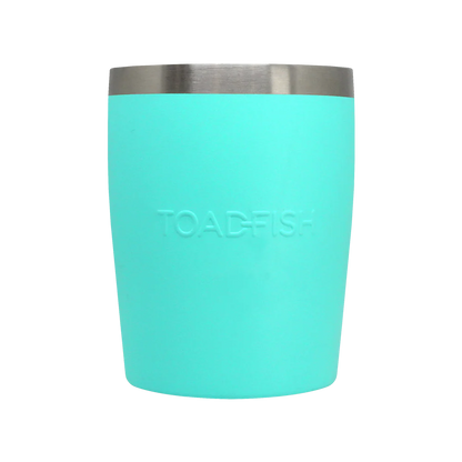 Turquoise tumbler with silver rim on a white background
