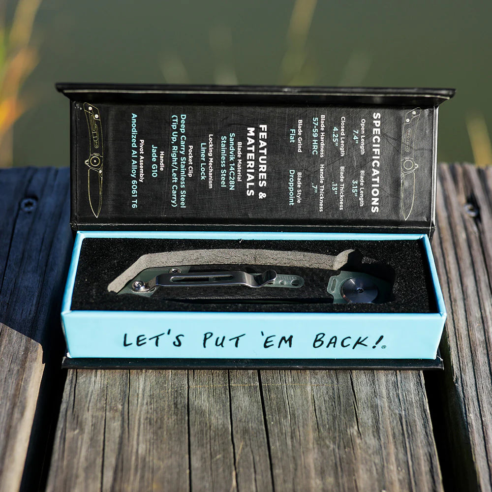 Open knife box with a knife inside on a wooden surface