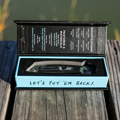 Open knife box with a knife inside on a wooden surface