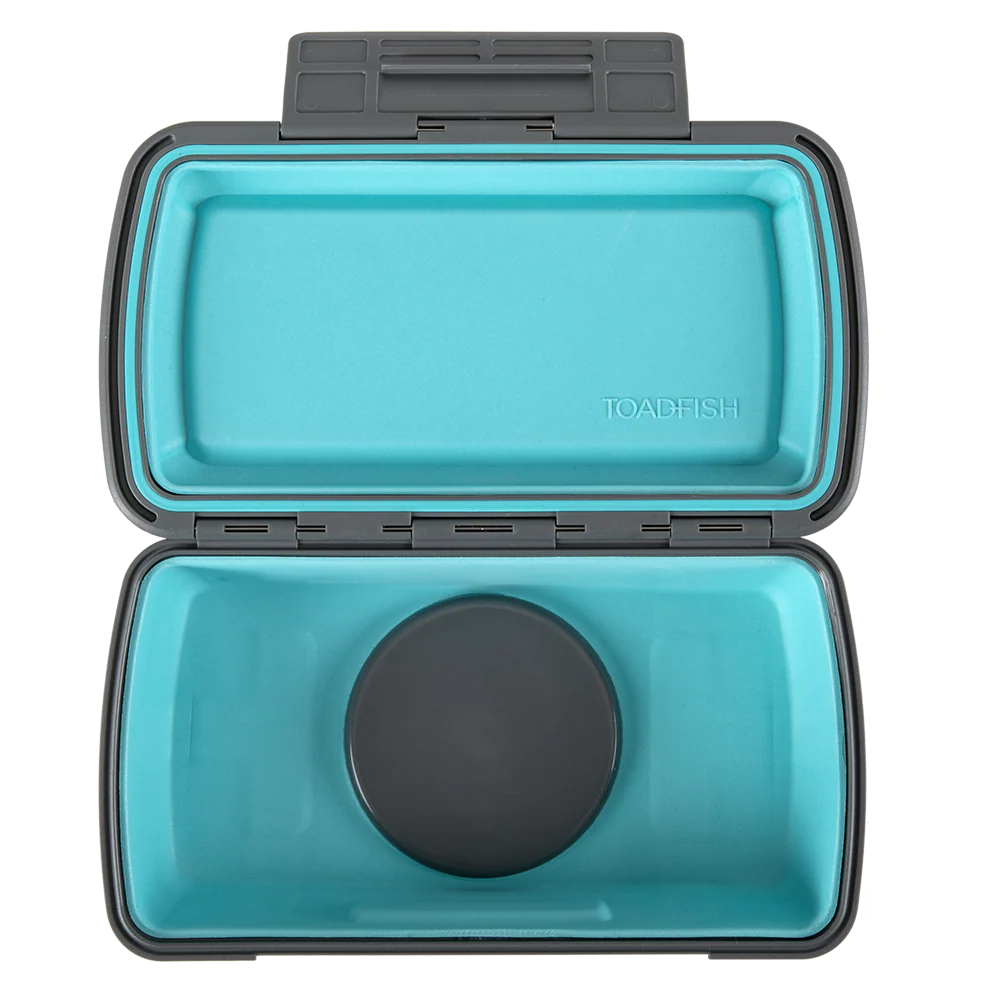 Open teal container with black lid on a white background