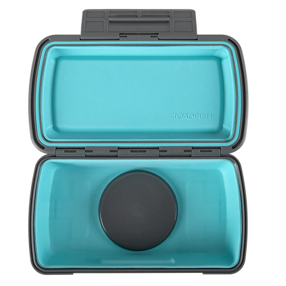 Open teal container with black lid on a white background