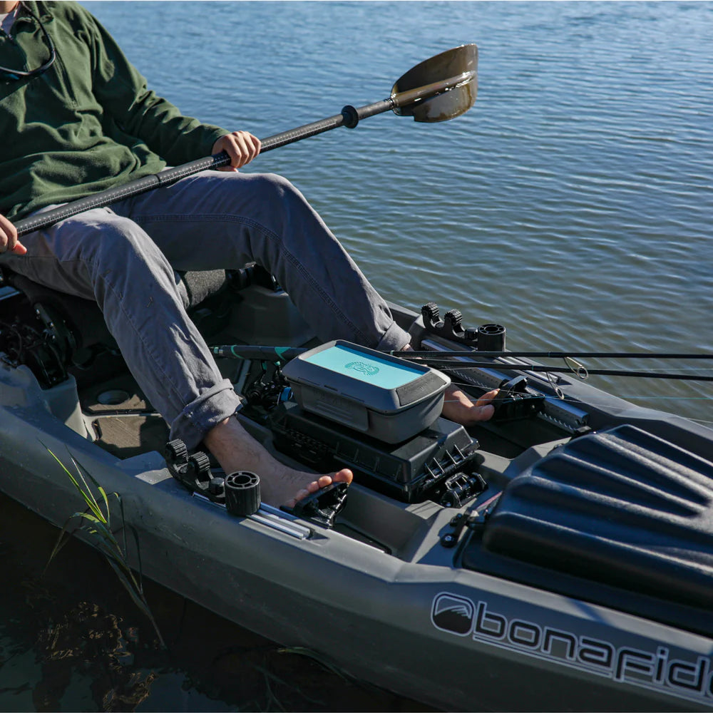 Person in a kayak on water with a Bonafide brand kayak