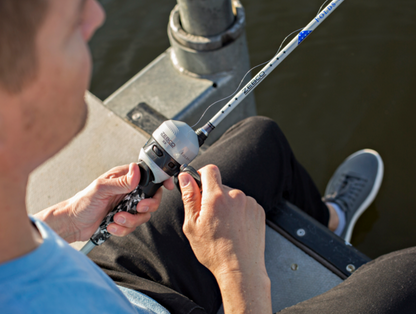 Fishing rod and reel set on a white background